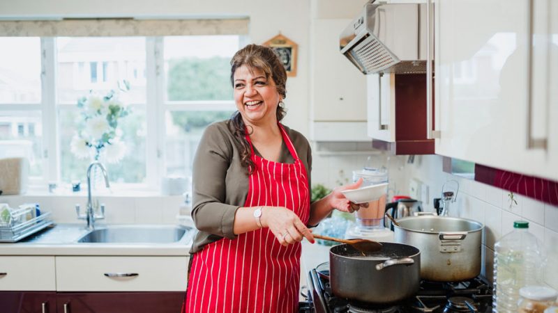 Mature Woman Enjoying Cooking at Home